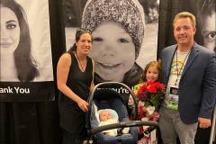 2022-08-27-Swackhamer-family-with-Paxtons-poster